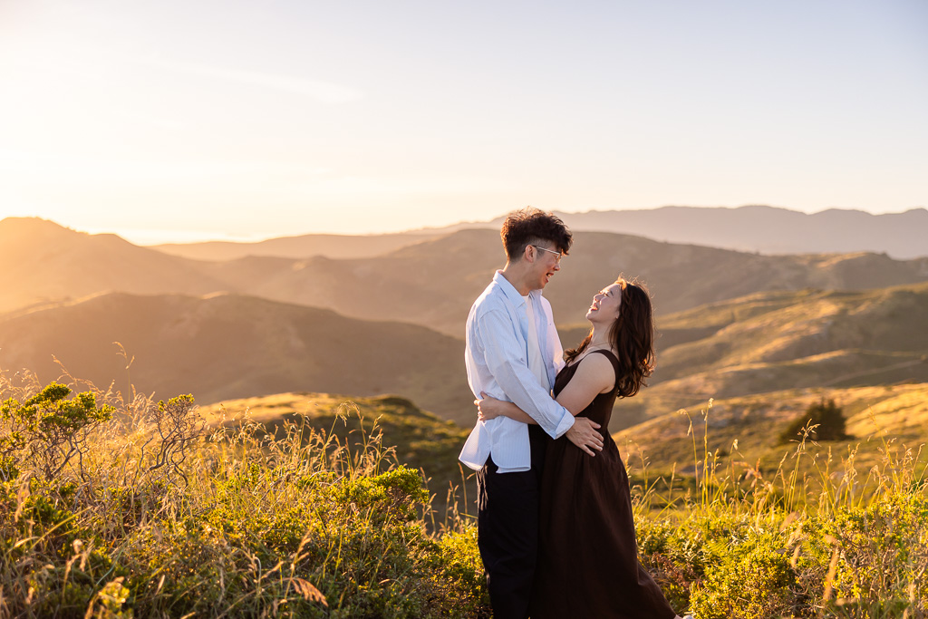 engagement photos during sunset hour set against endless rolling hills