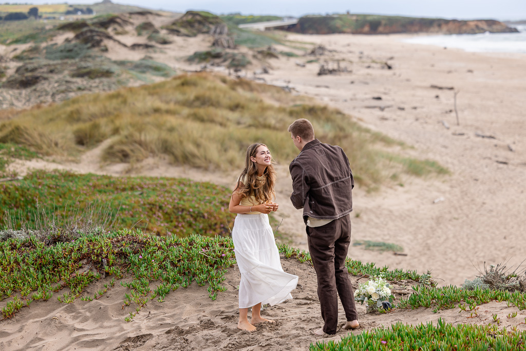 proposing on top of sand dunes