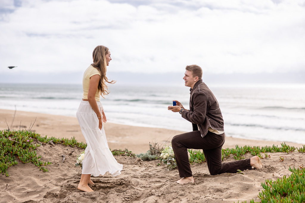 marriage proposal on a sand dune on the beach