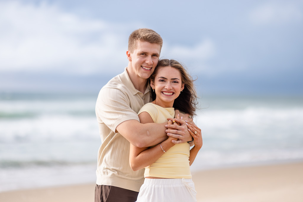 engagement photos on the beach by the ocean