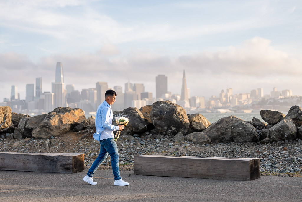man walking with bouquet of flowers