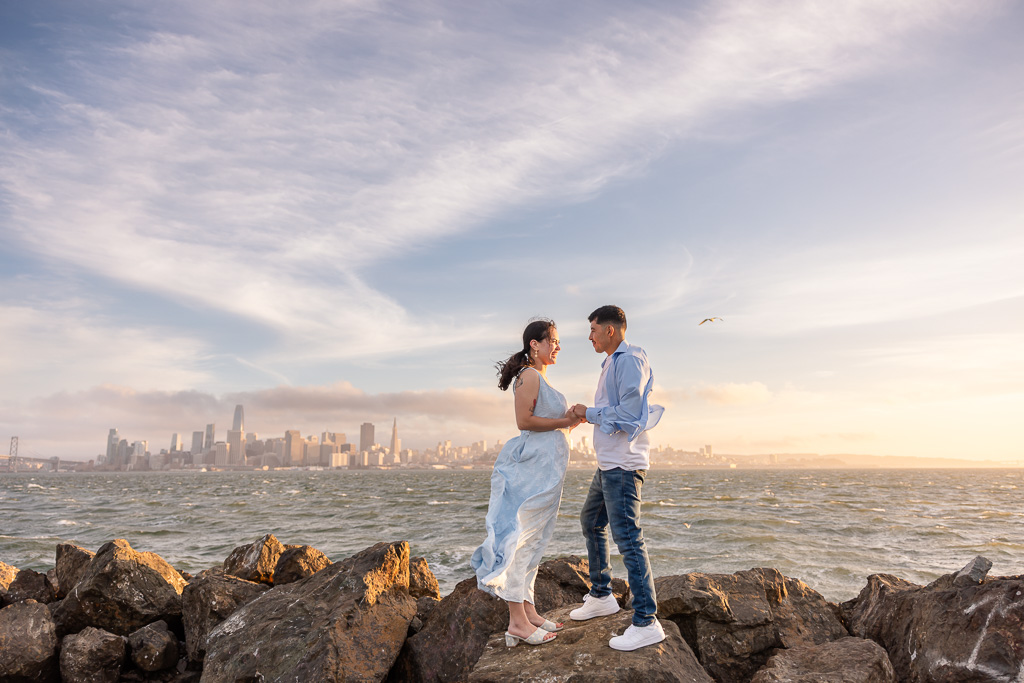 engagement shoot on the rocks at Treasure Island