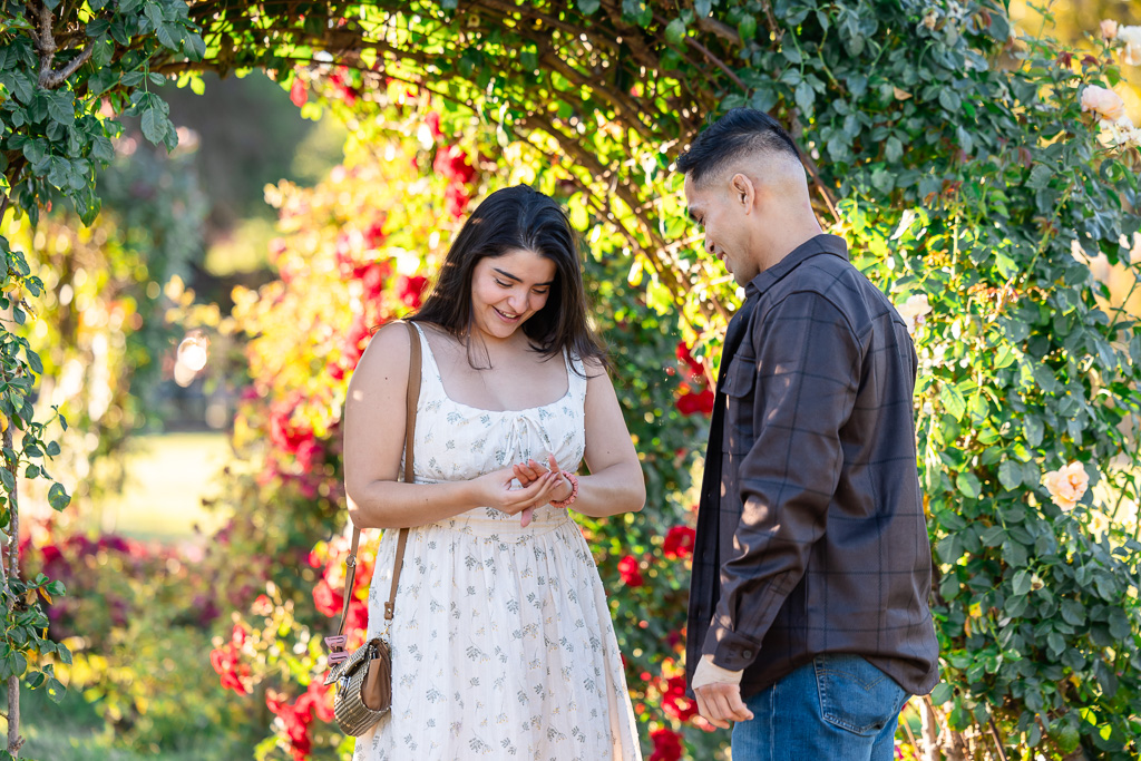 checking out her shiny new engagement ring