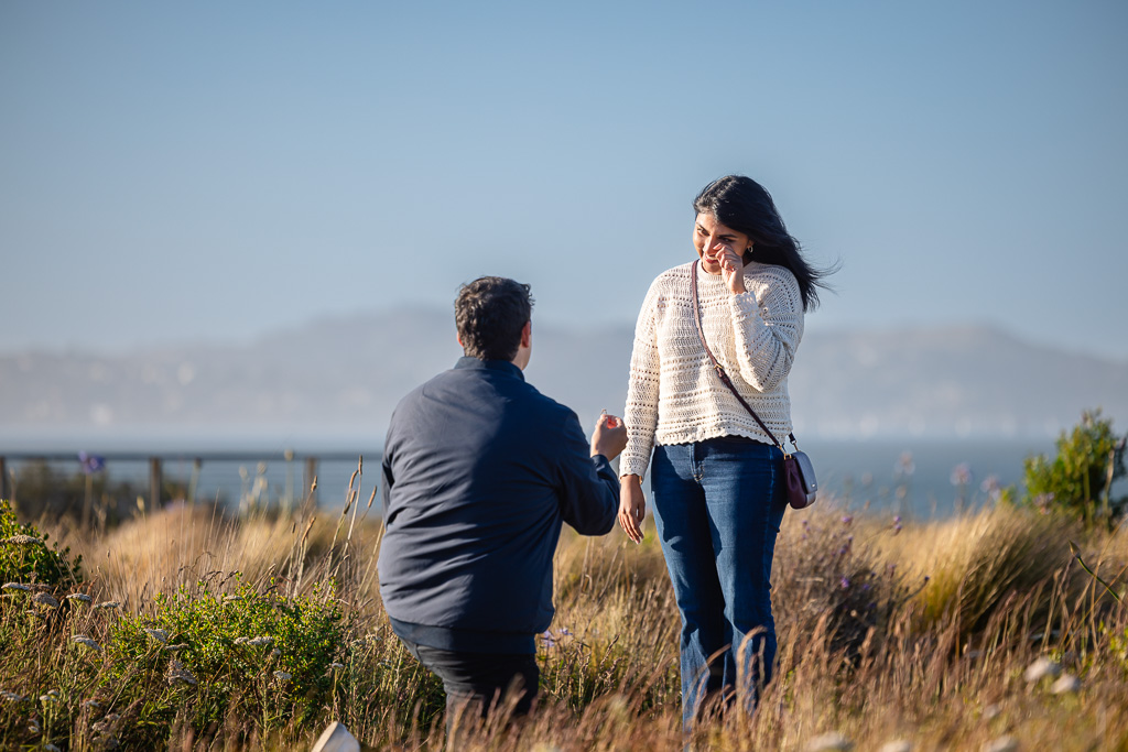 wiping away a happy tear during marriage proposal
