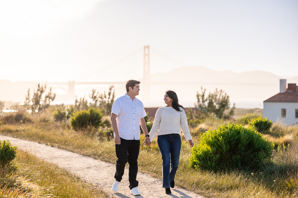 couple walking along the Tunnel Tops during golden hour