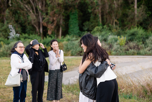 bride-to-be hugging family members who are there to celebarte her engagement