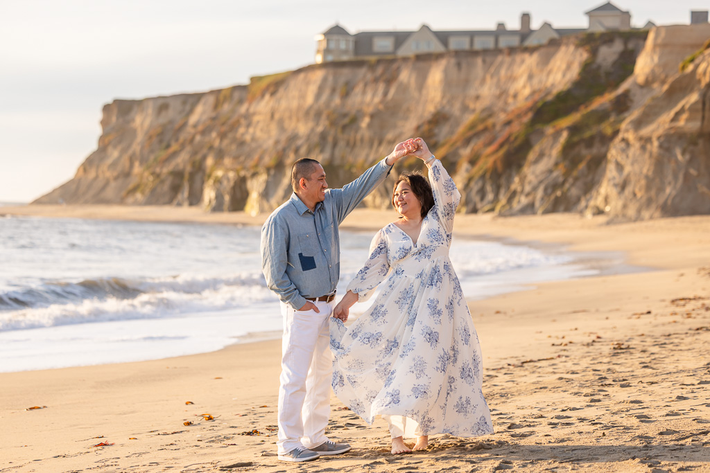 doing a little twirl/dance on the beach