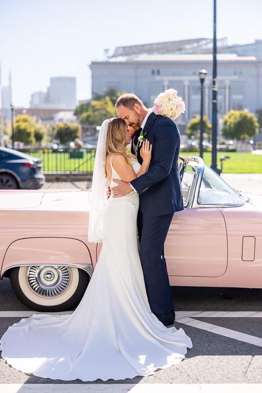 San Francisco City Hall elopement photo with a pink Ford Thunderbird