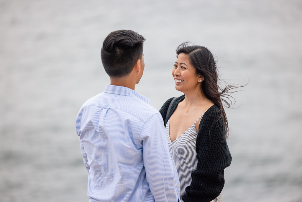 a girl getting proposed to near the ocean