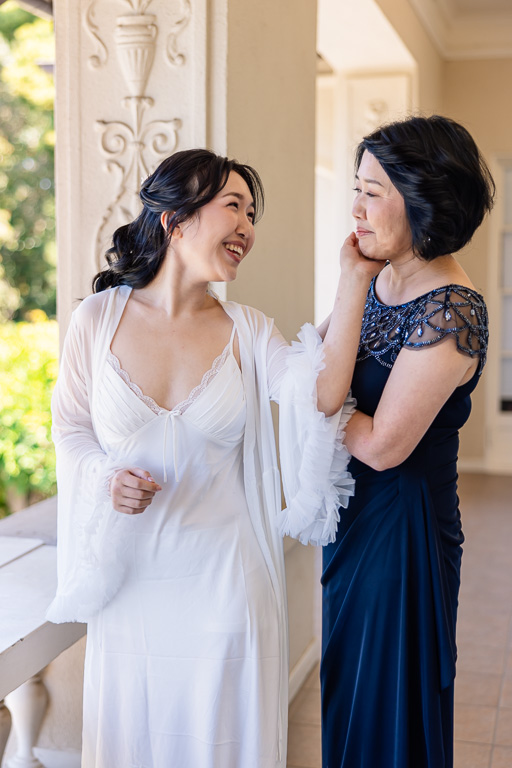 bride and mom sharing a touching moment during getting ready