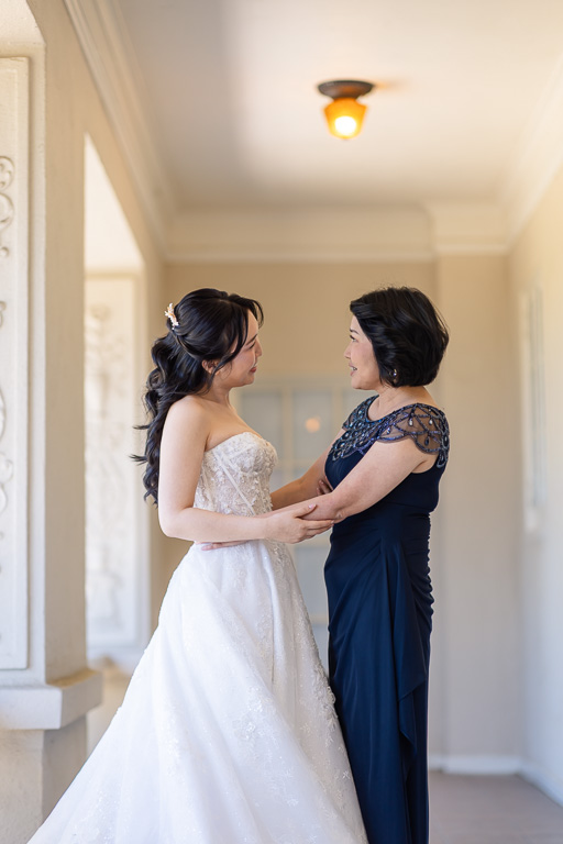 a family moment between the bride and her mom during wedding prep