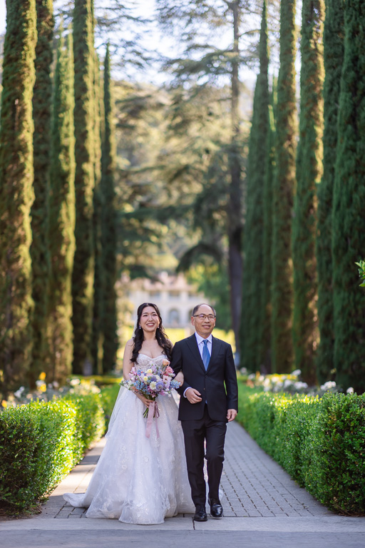 Bride and father of the bride making their entrance into the ceremony at Villa Montalvo’s Italian Garden