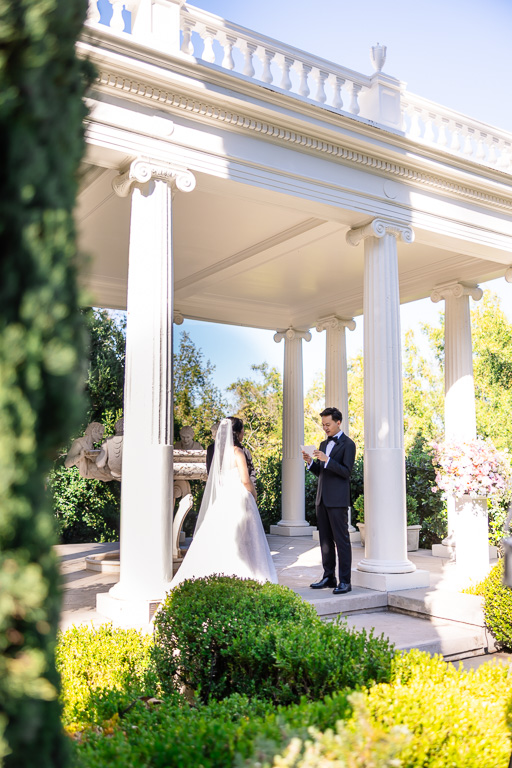 groom reading his written wedding vows at the Italianate Garden at Villa Montalvo