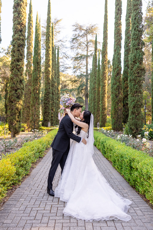 bride and groom kissing in the Italianate Garden
