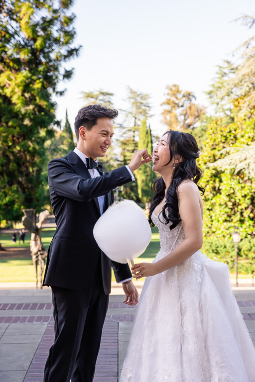 groom feeding the bride cotton candy
