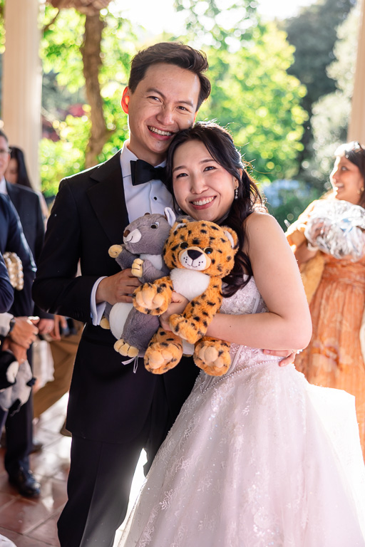 bride and groom with their completed build-a-bear stuffies