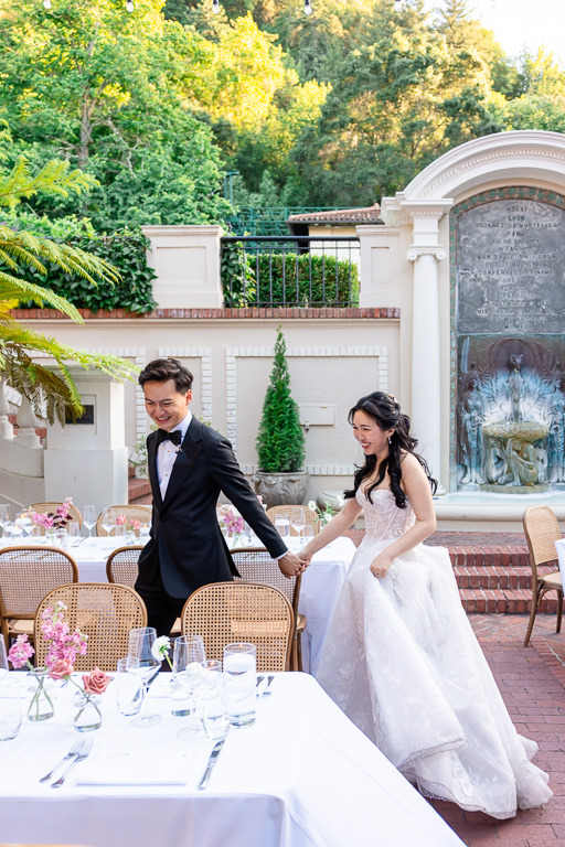 bride and groom checking out their wedding reception setup and decor