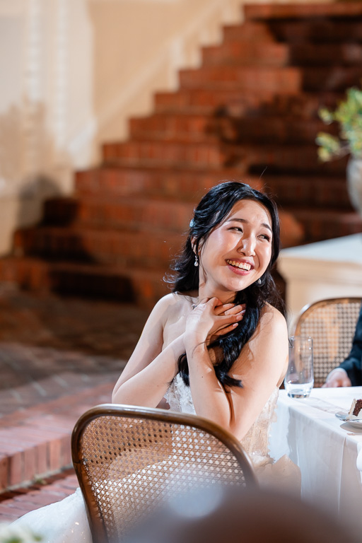 bride making an awww expression during speeches