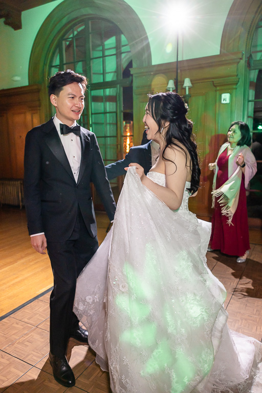candid shot of bride and groom on the dance floor
