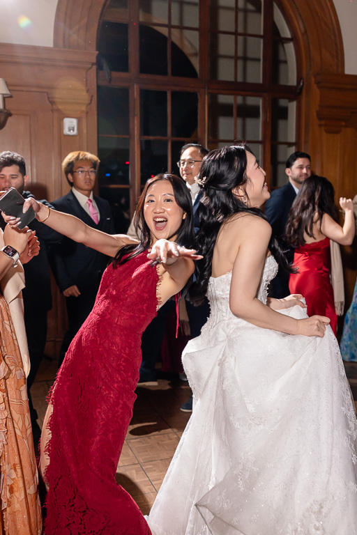 bride and her bestie on the dance floor