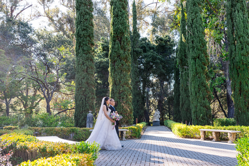 bride and her father walking down the long aisle at the Italian Garden at Montalvo