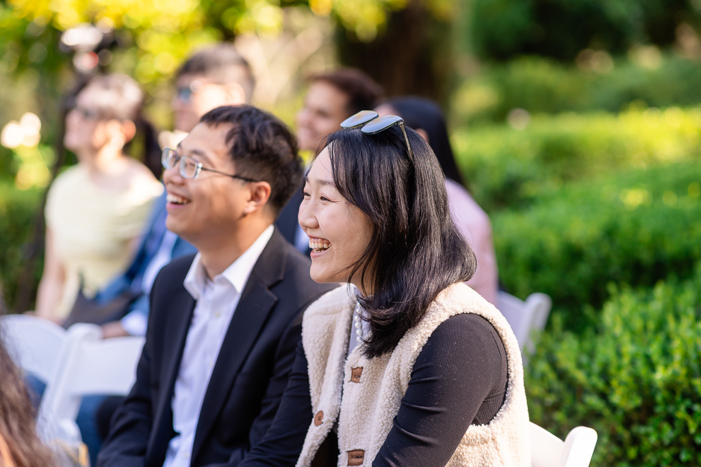 guests laughing during the wedding ceremony