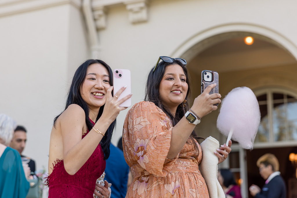 wedding guests taking cell phone photos