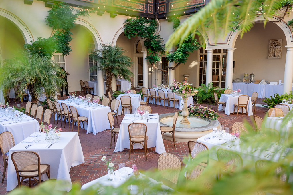elegant luxury wedding reception tables and chairs at the Montalvo Arts Center Spanish Courtyard