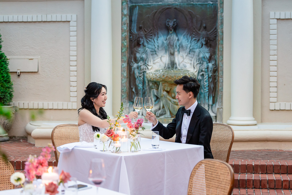 bride and groom having a drink together