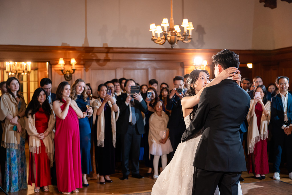 Villa Montalvo first dance between bride and groom while guests watch in the background
