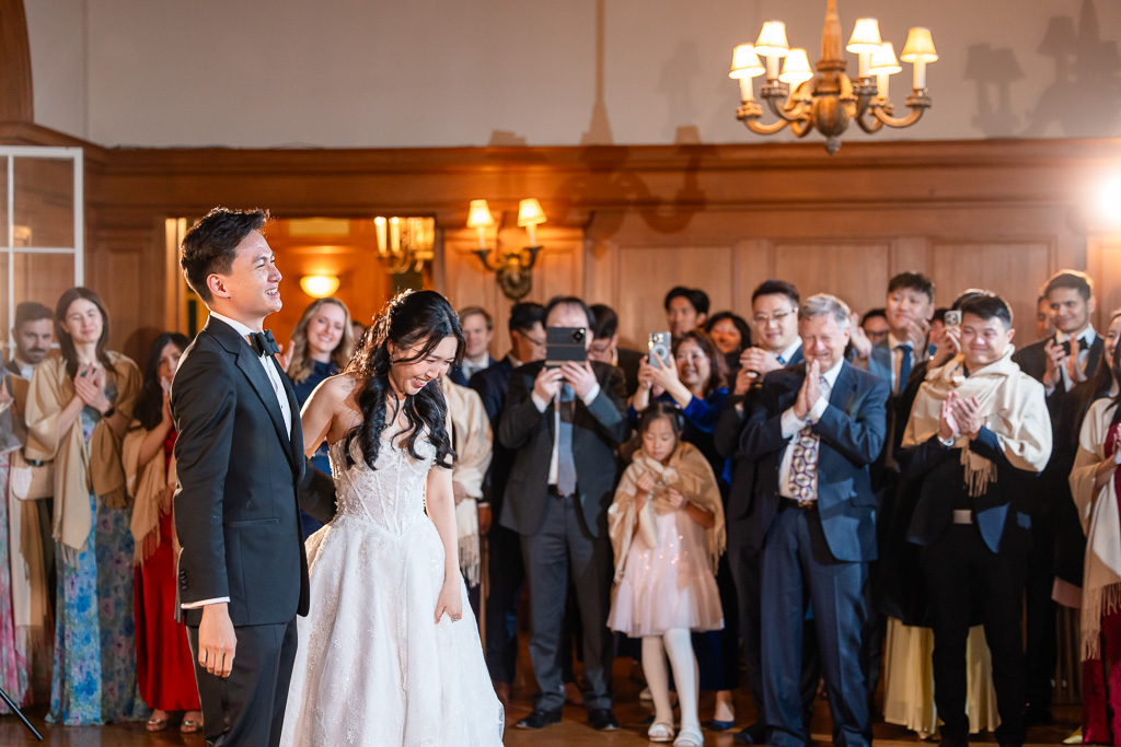 family and friends cheering and clapping after first dance