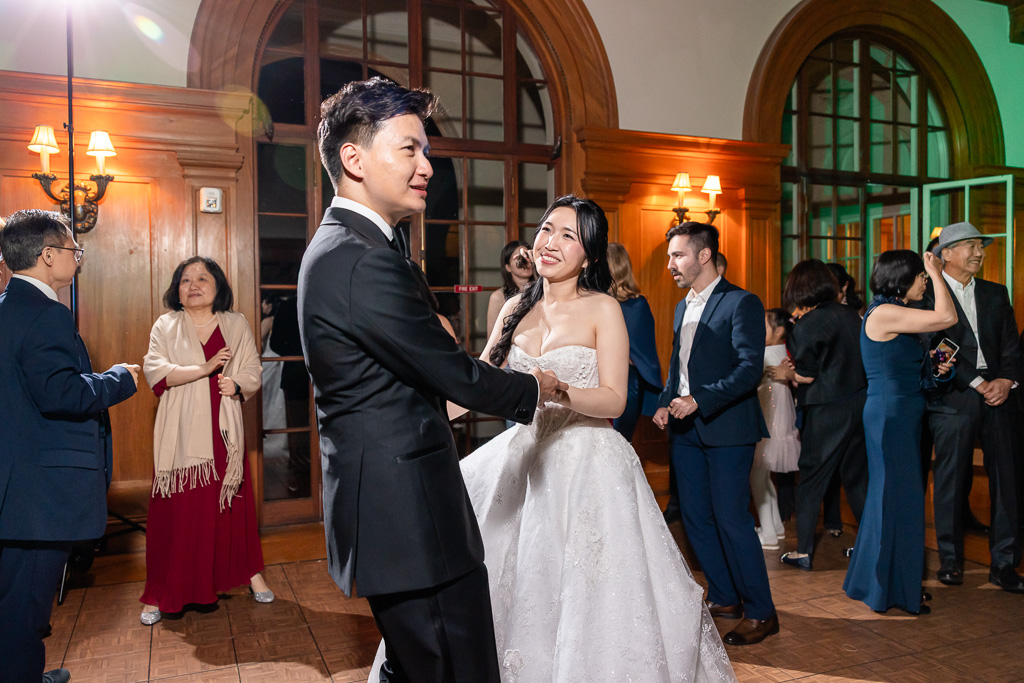 bride and groom as the center of attention during open dancing