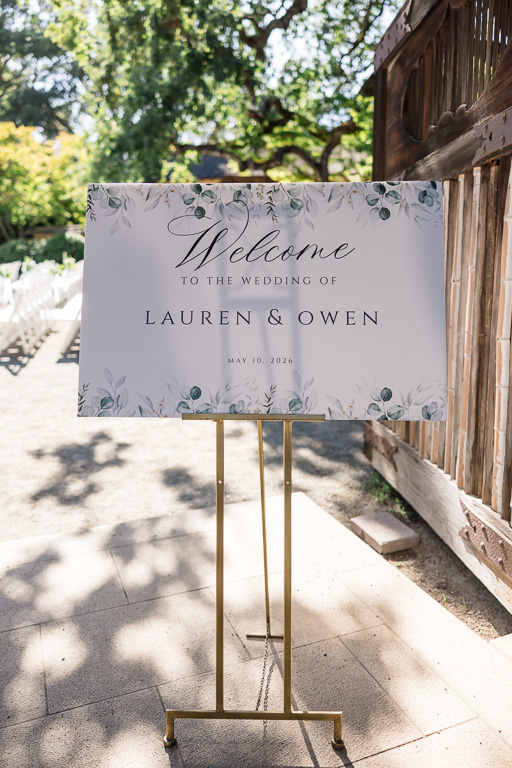 wedding welcome sign on a golden easel