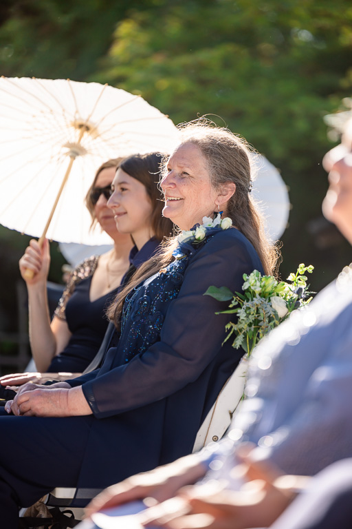 mom looking on during the ceremony
