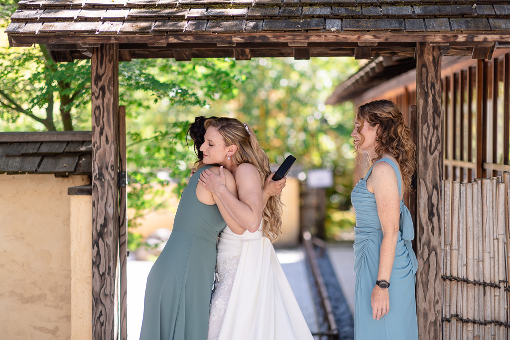 bride hugging her bridesmaid