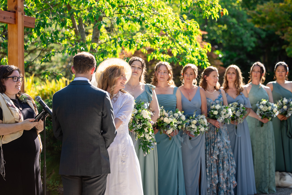 bride with bridesmaids behind her during the ceremony