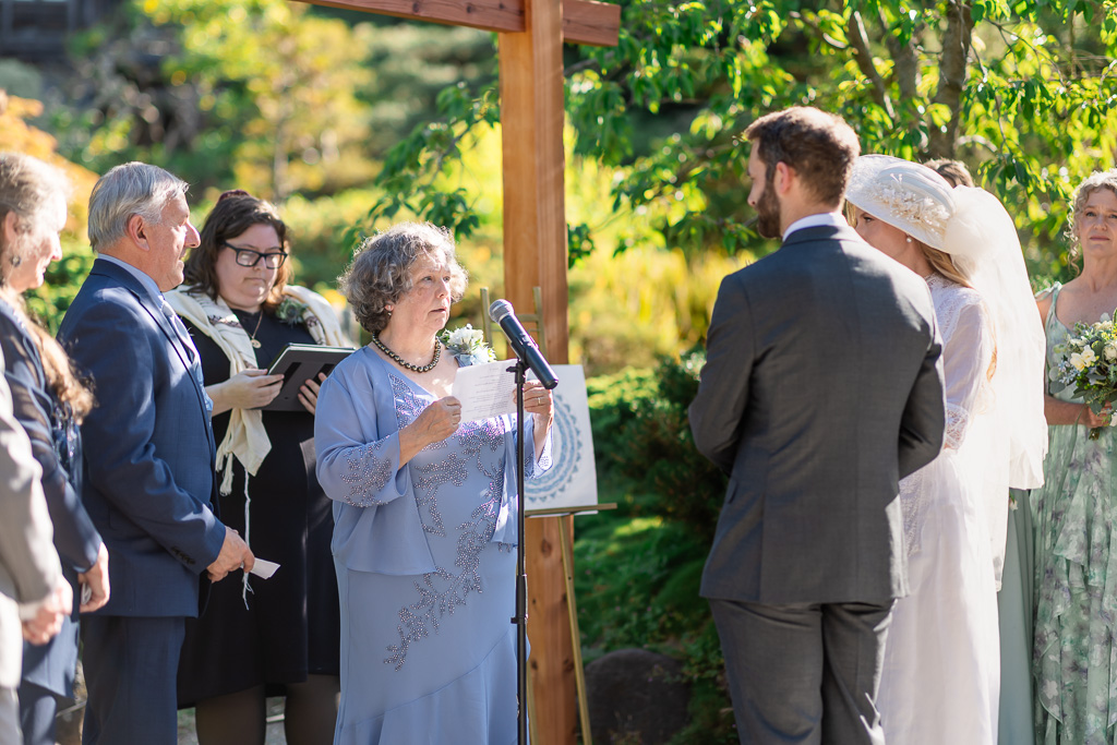 mother giving a reading during the wedding ceremony