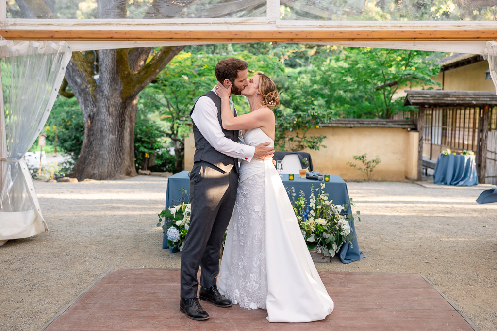 bride and groom sharing a kiss