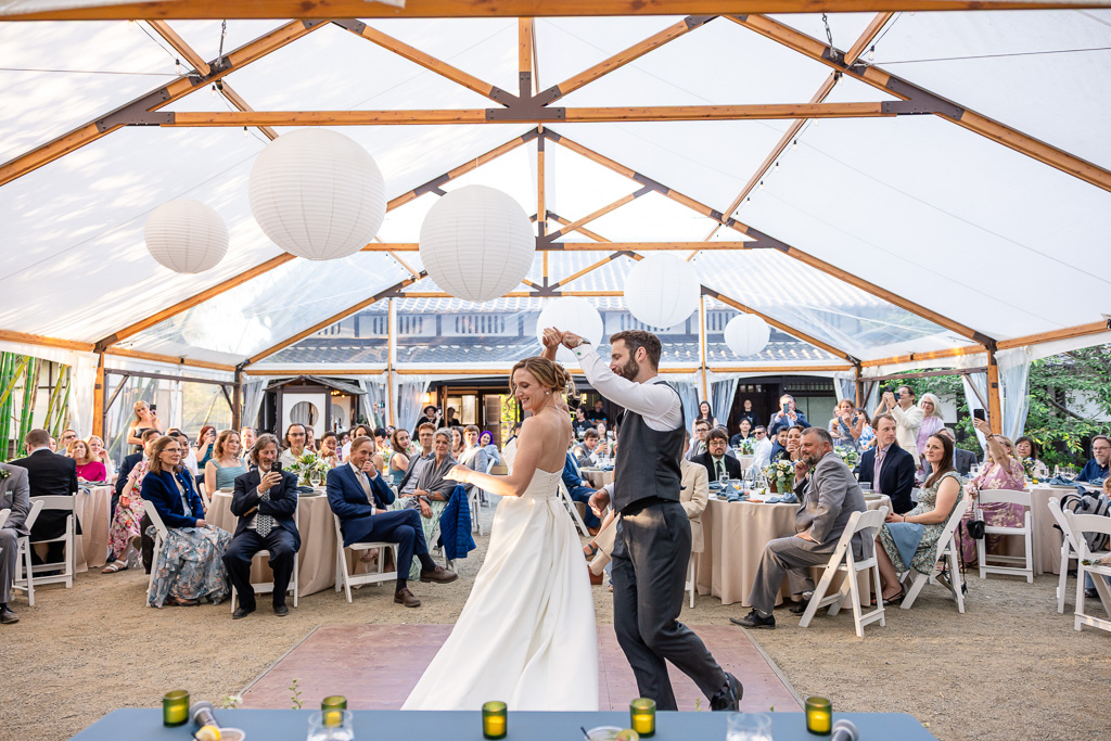newlywed first dance at Hakone Gardens under a tented reception area