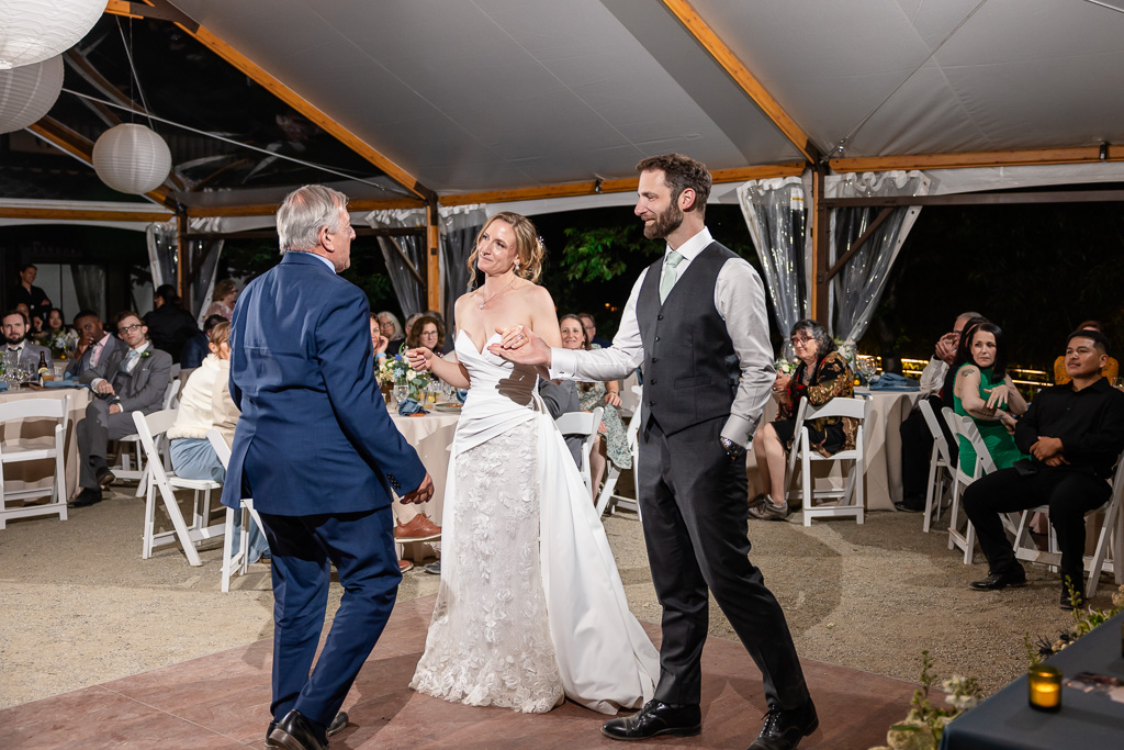groom handing off bride to dad for father/daughter dance