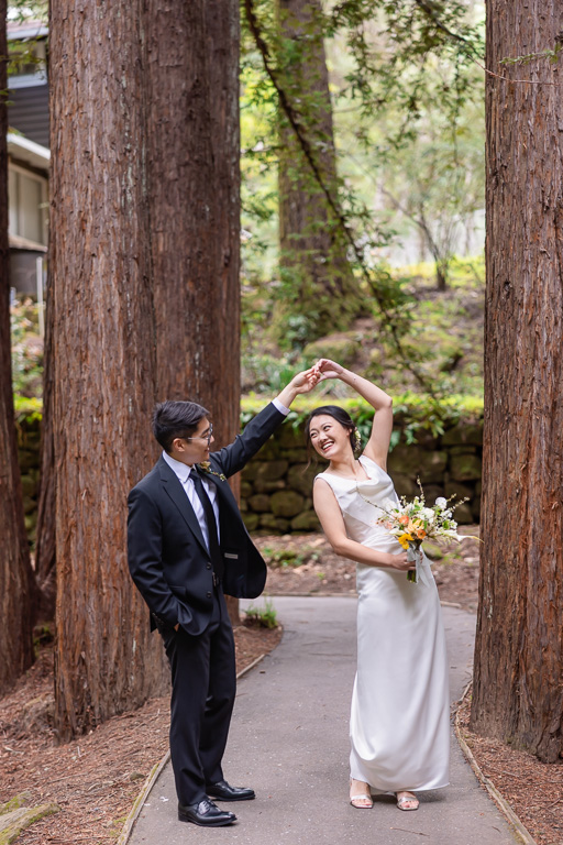 bride and groom sharing a little dance in the redwoods