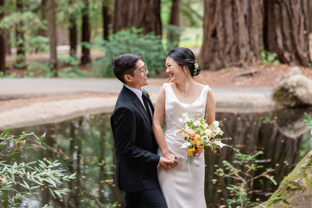 portrait of the happy couple at a small lake in the woods