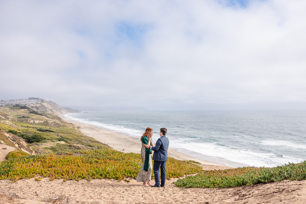 man giving his proposal speech to his fiancee-to-be on the coastal bluffs of Northern California