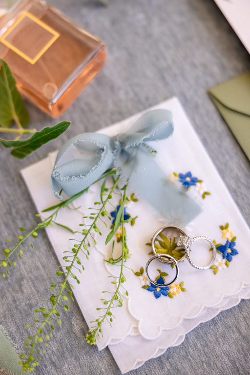 wedding ring and something blue ribbon and handkerchief flat lay