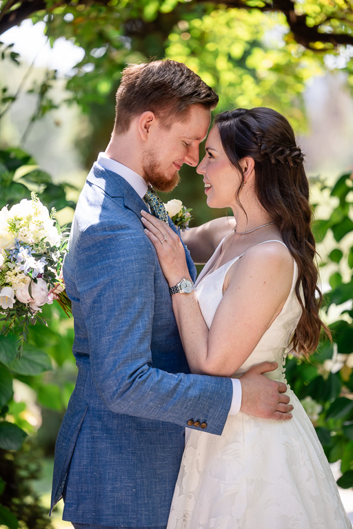 portrait of the bride and groom in a sunny garden