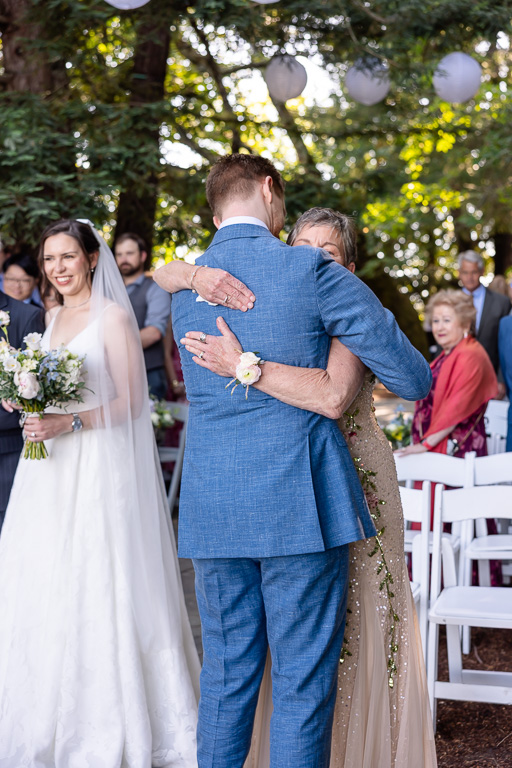 groom giving mom a hug