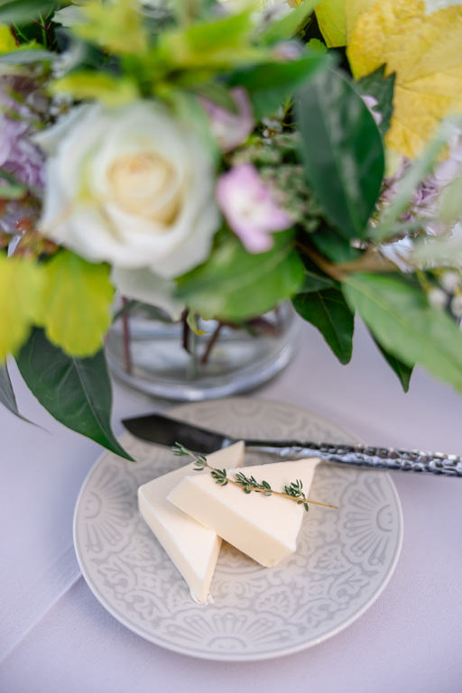 reception table with plate setting and floral centerpiece
