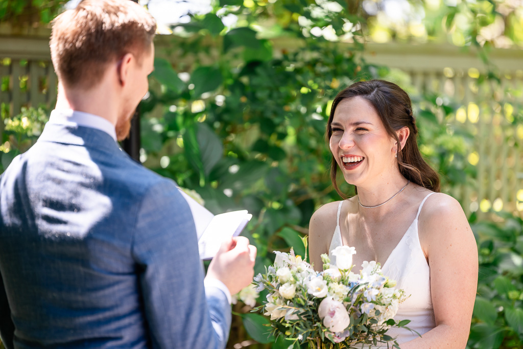 bride's laughing reaction to groom's private vows