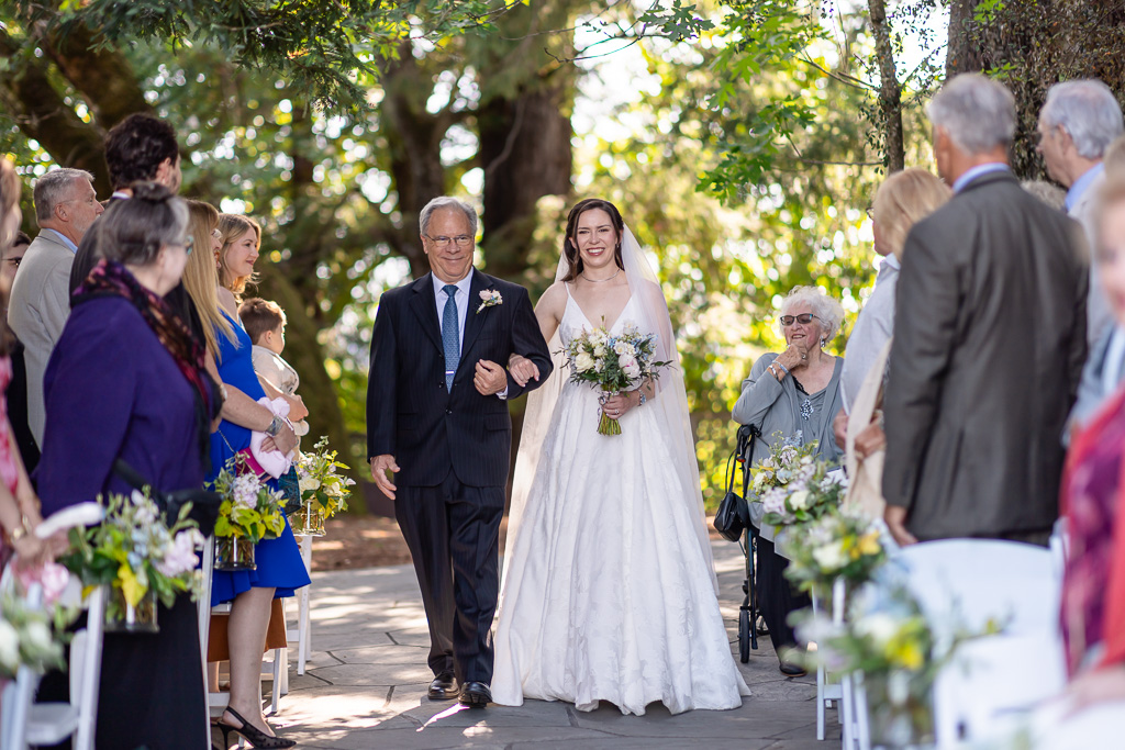 bride and her dad walking up the aisle at Vine Hill House