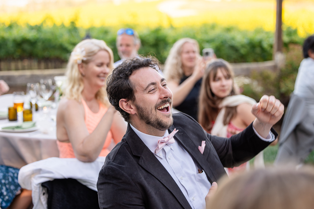 a guest cheering for the bride and groom